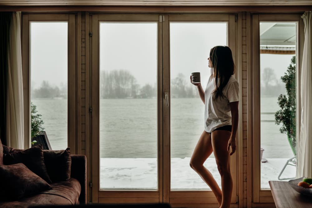 lonely woman staring out window