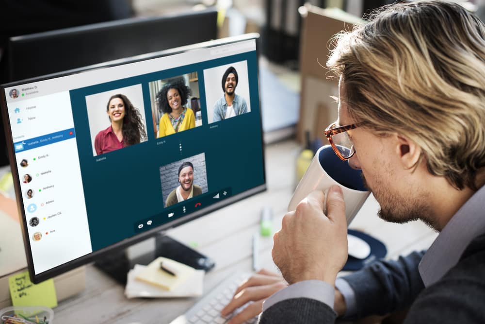 man video chatting with friends