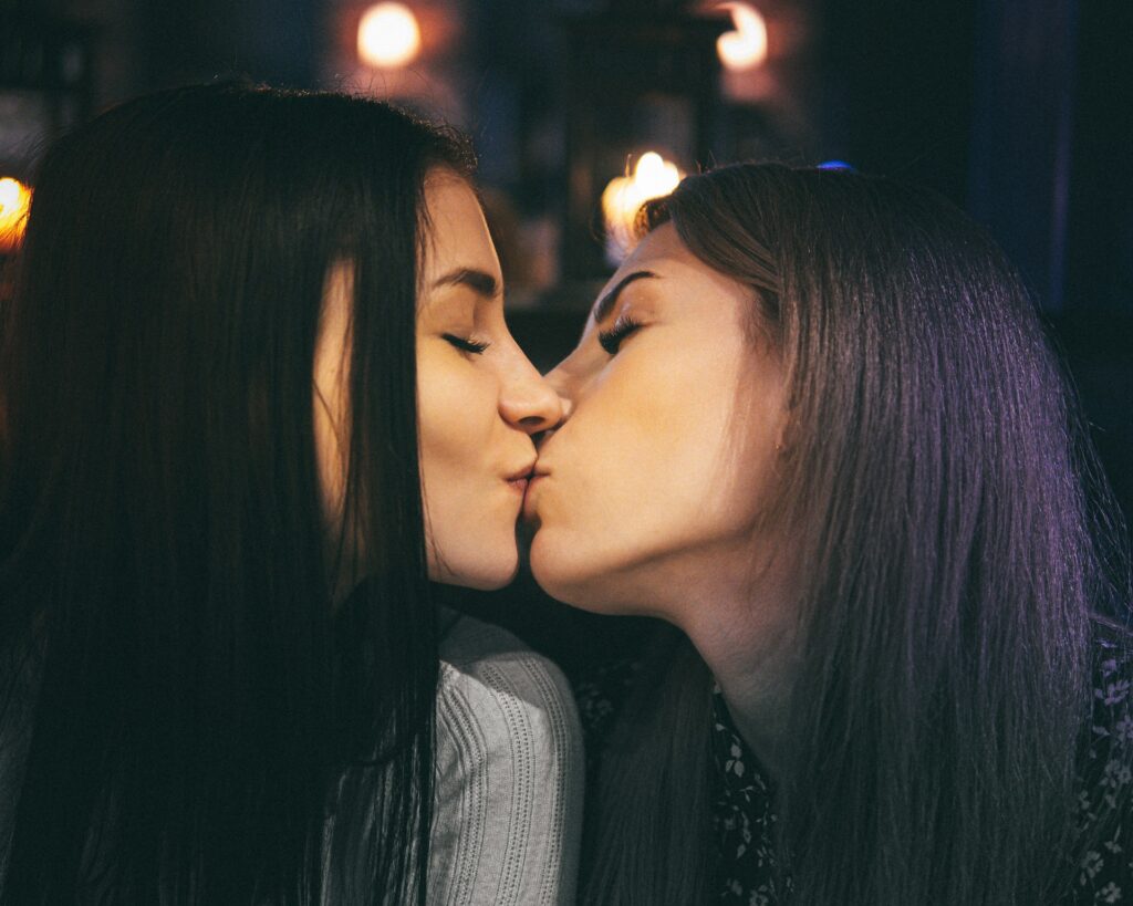 two women kissing 